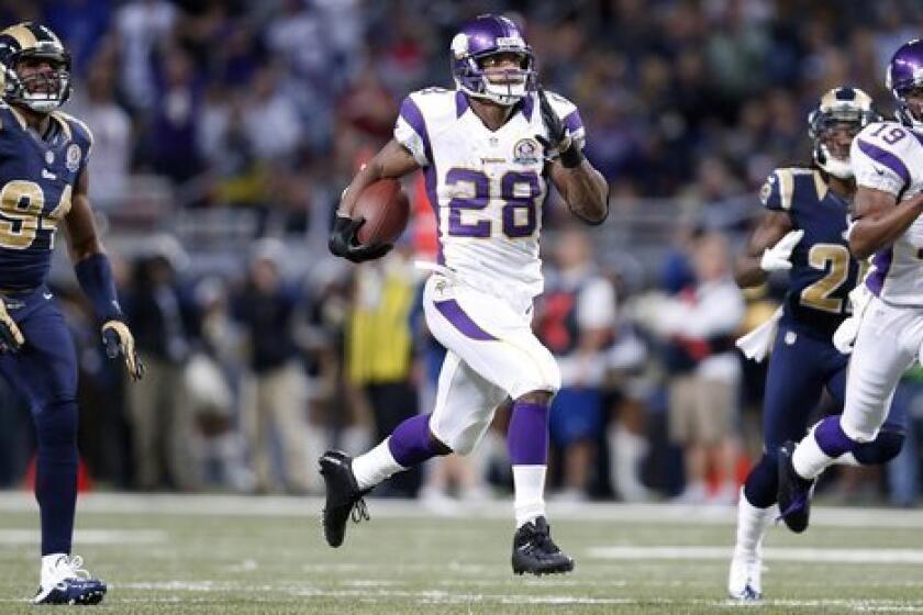 Minnesota Vikings running back Adrian Peterson runs 82 yards for a touchdown Sunday against the St. Louis Rams.