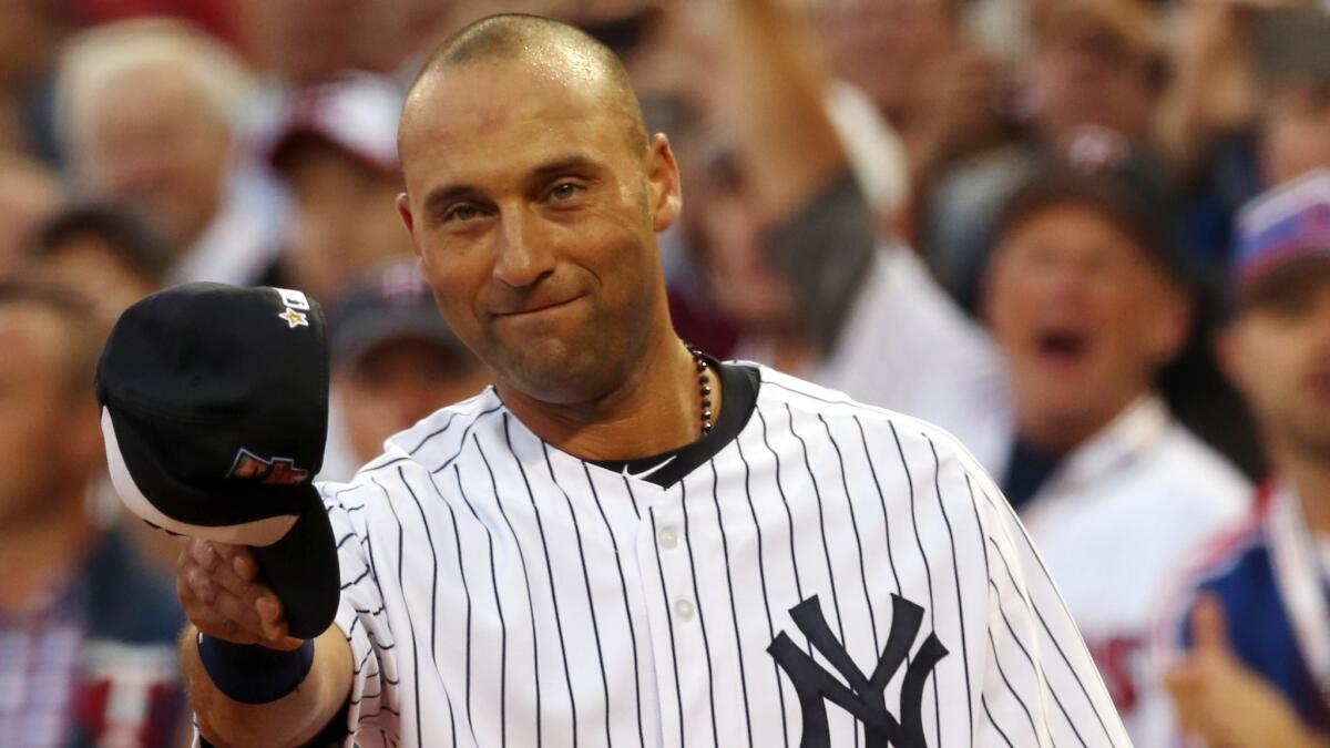 New York Yankees shortstop Derek Jeter receives a standing ovation from fans and players upon being taken out of the MLB All-Star Game in the fourth inning Tuesday at Target Field in Minneapolis.