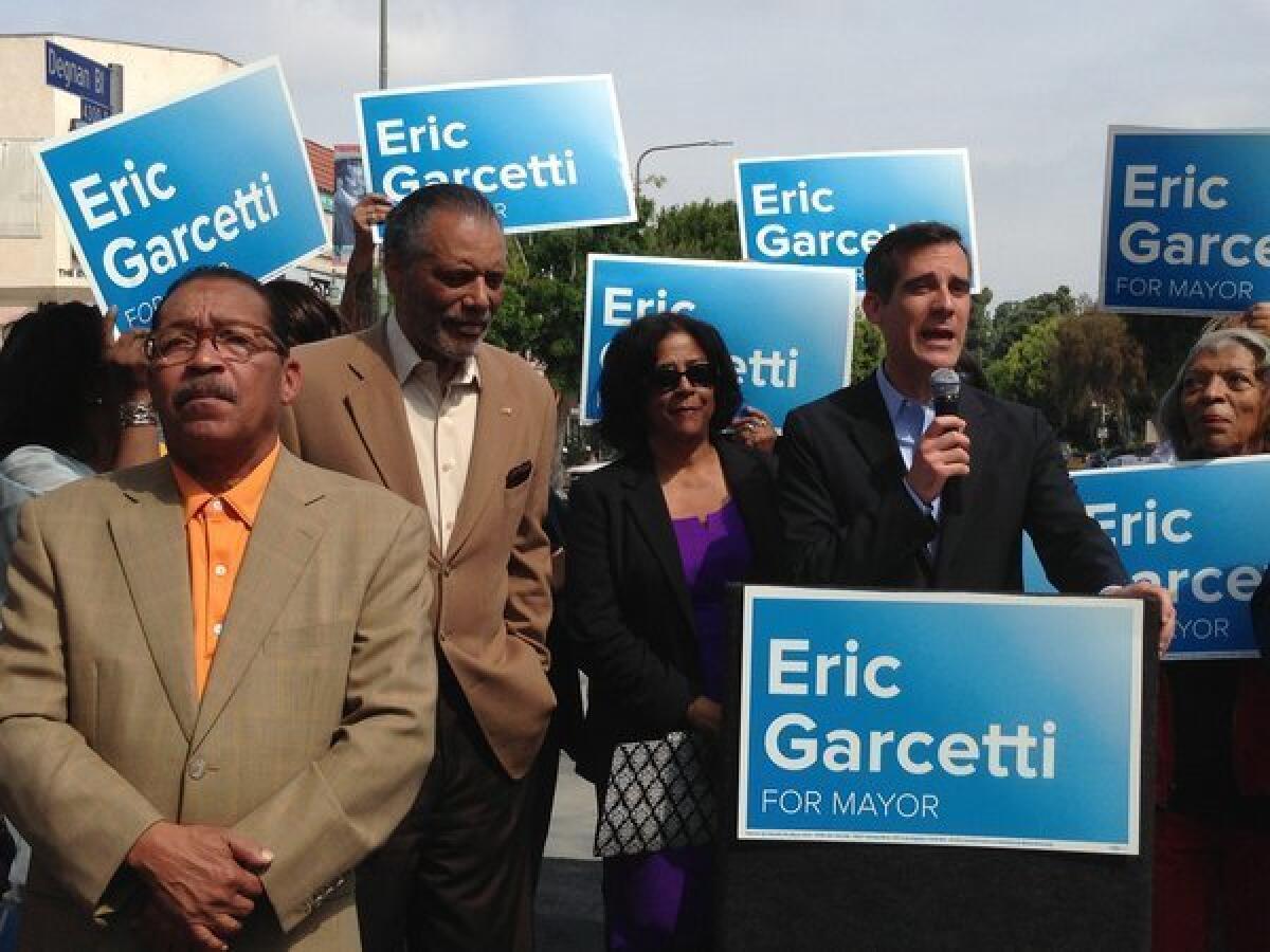 Mayoral candidate Eric Garcetti speaks at a rally in Leimert Park with Herb Wesson, left, Bernard Parks and Jan Perry. The three City Council members endorsed Garcetti.