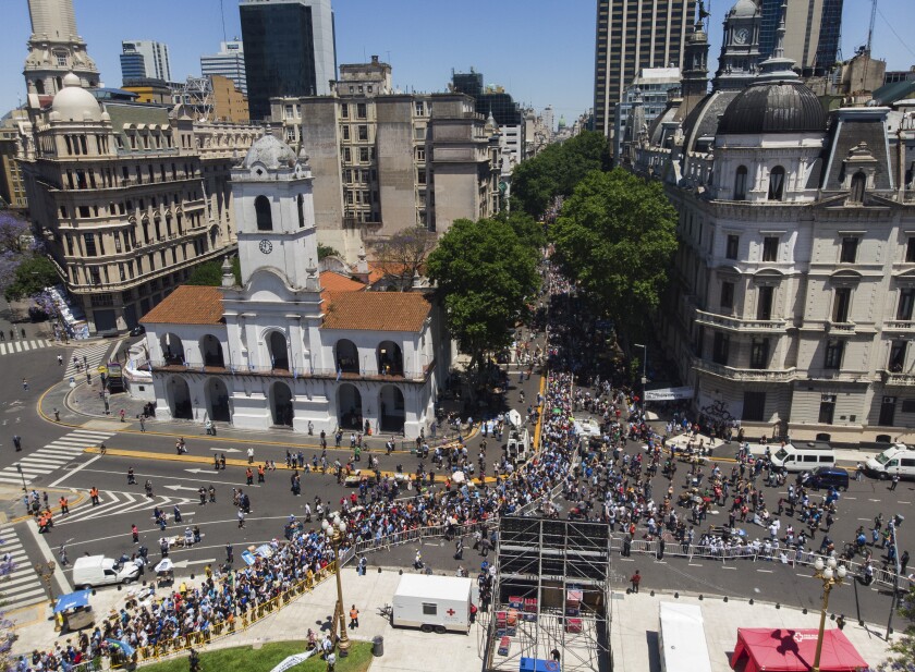 People line up outside the presidential palace alongside Plaza de Mayo