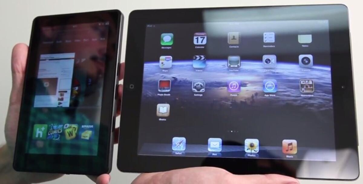 The Amazon Kindle Fire, left, and the Apple iPad 2.