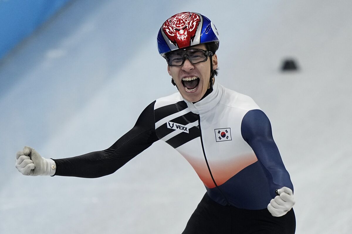 Hwang Dae-heon of South Korea, reacts after winning his men's 1500-meters final during the short track speedskating competition at the 2022 Winter Olympics, Wednesday, Feb. 9, 2022, in Beijing. (AP Photo/David J. Phillip)