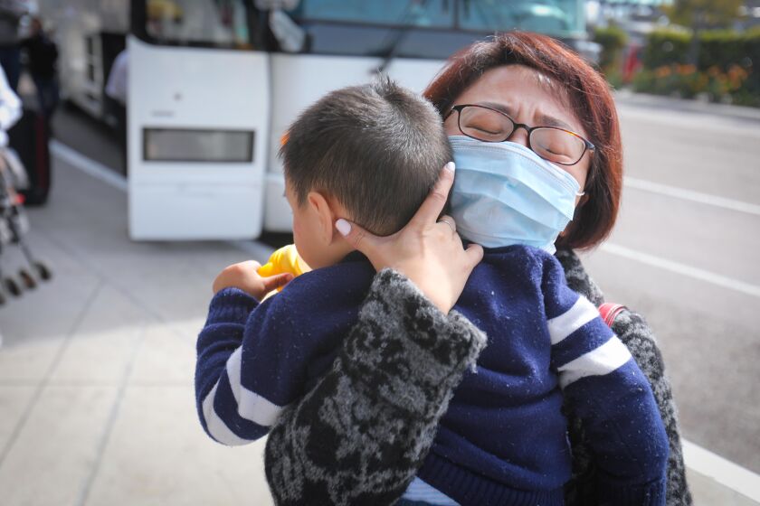 Cynthia, who did not give her last name, traveled from Texas to San Diego to meet her son Alan, 2. He was one of the coronavirus evacuees from China who completed the 14-day quarantine at Marine Corps Air Station Miramar and was released on Thursday, February 20, 2020. Cynthia was emotional as she holds the toddler, the first one off a charter bus when it arrived at San Diego International Airport from the Marine Corps base. The group is the second wave of evacuees to be released from quarantine. The first group was released on Tuesday, February 18, 2020.