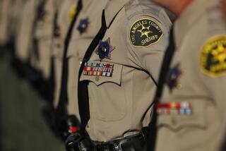 LOS ANGELES, CA-OCTOBER 27, 2017: Los Angeles County Sheriff's deputies stand at attention during the inspection portion of their graduation ceremony at the Biscailuz Training Center of the Los Angeles County Sheriff's Dept. in East Los Angeles on October 27, 2017. (Mel Melcon/Los Angeles Times)