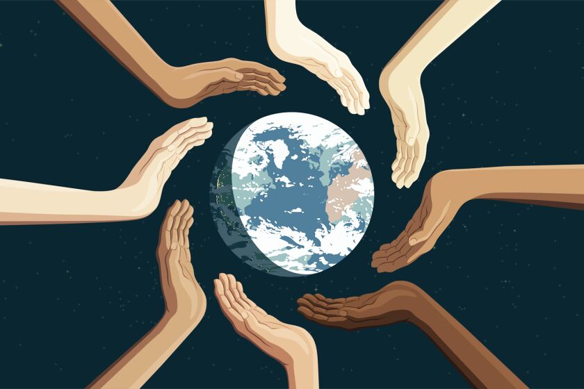 hands representing various ethnic backgrounds circling the Earth