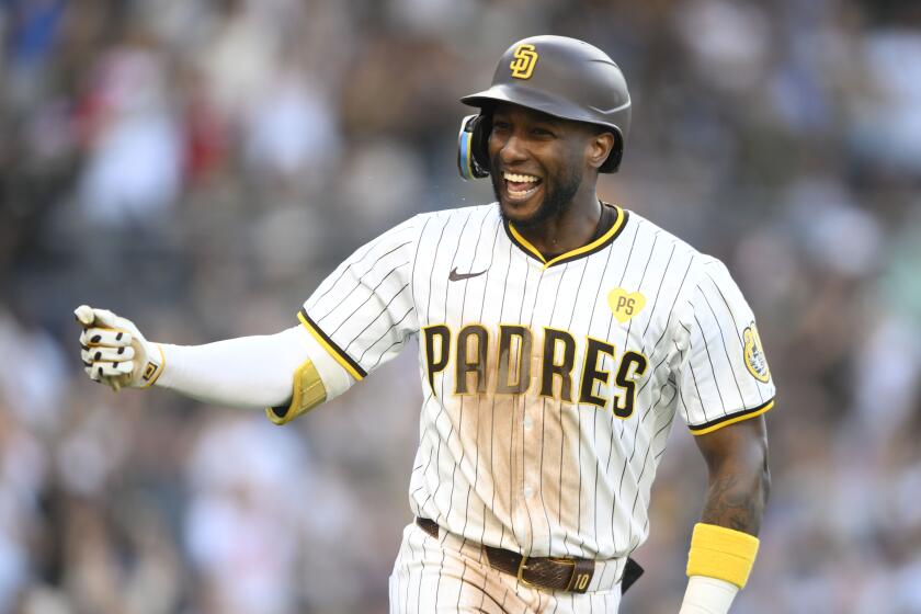 San Diego Padres' Jurickson Profar celebrates after hitting a two-run home run against the Chicago Cubs during the sixth inning of a baseball game Wednesday, April 10, 2024, in San Diego. (AP Photo/Denis Poroy)