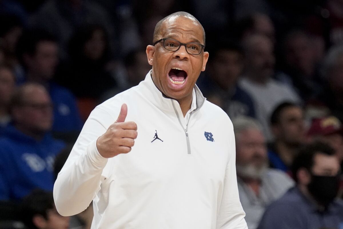 North Carolina head coach Hubert Davis works the bench in the first half of an NCAA college basketball game against Virginia Tech during semifinals of the Atlantic Coast Conference men's tournament, Friday, March 11, 2022, in New York. (AP Photo/John Minchillo)