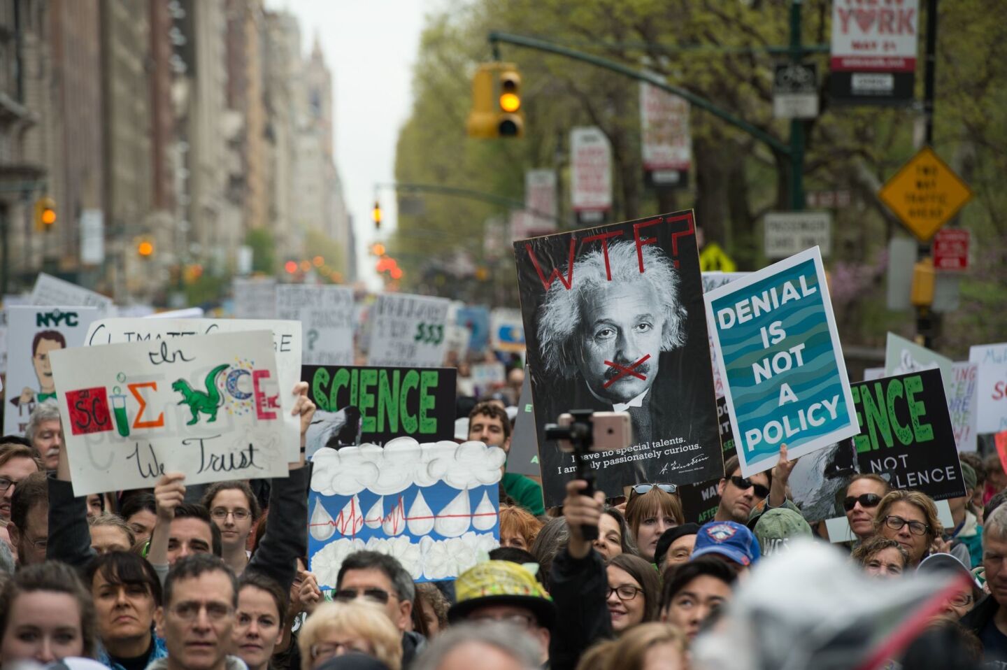 New York March for Science participants rally on Central Park West.