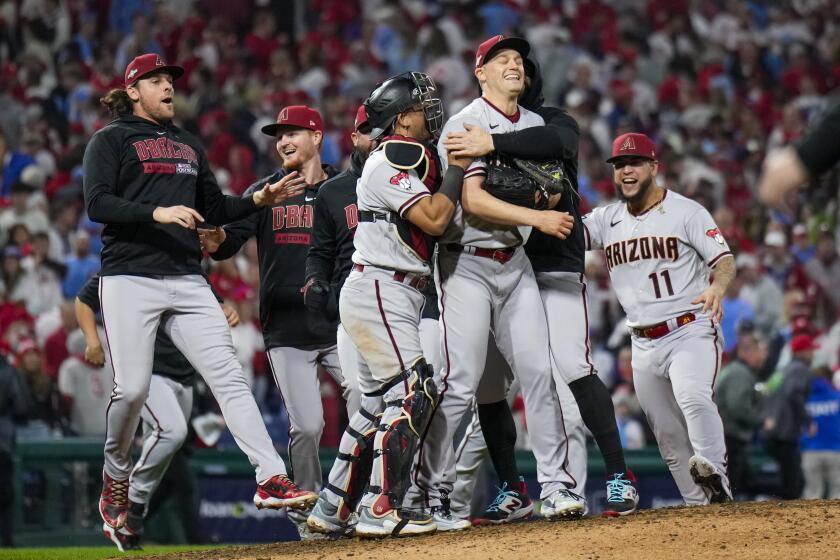 The Arizona Diamondbacks celebrates their win against the Philadelphia Phillies in Game 7 of the baseball NL Championship Series in Philadelphia Wednesday, Oct. 25, 2023. (AP Photo/Matt Slocum)