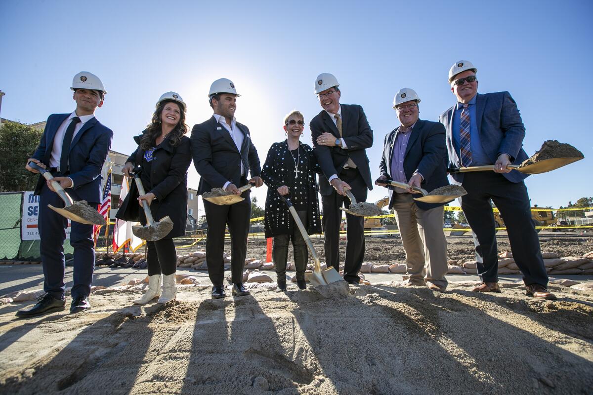 Vanguard administrators and local leaders pose for photos during Tuesday's groundbreaking ceremony for the  Freed Center.