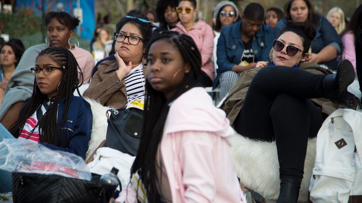 Attendees listen during an outdoor workshop at the Teen Vogue Summit.