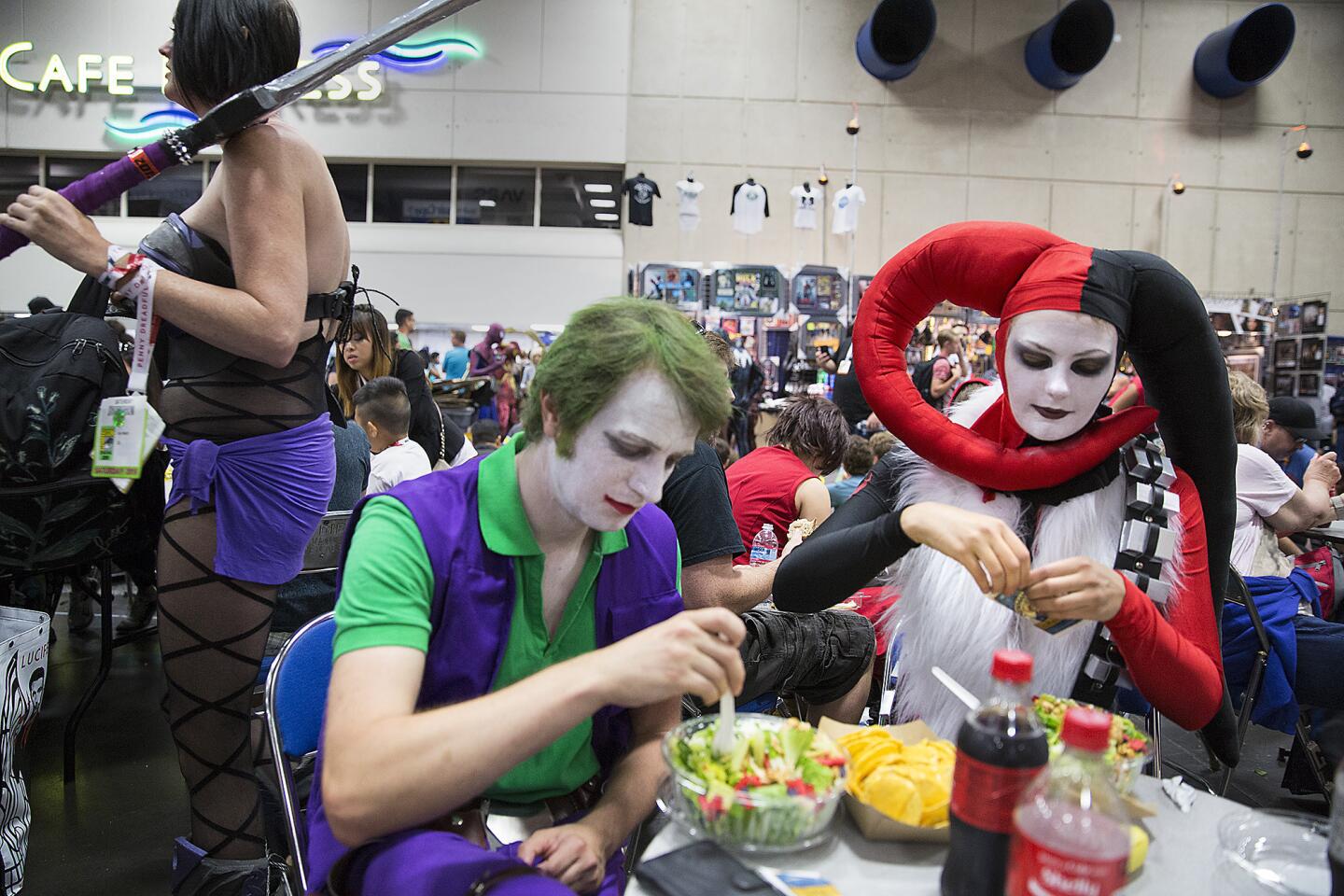 Cosplayers Bo Dyrby, left, and Susanne Nielsen of Copenhagen take a lunch break at Comic-Con International 2015 in San Diego.