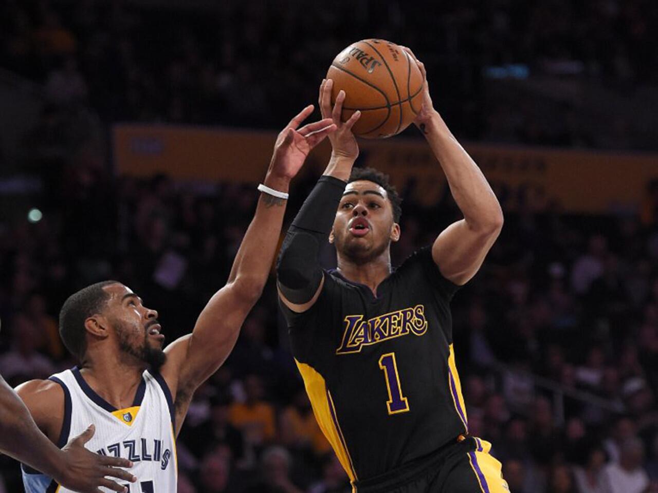 D'Angelo Russell drives to the basket against Memphis guard Mike Conley during the first half of the Lakers' 112-95 loss to the Grizzlies on Feb. 26 at Staples Center.