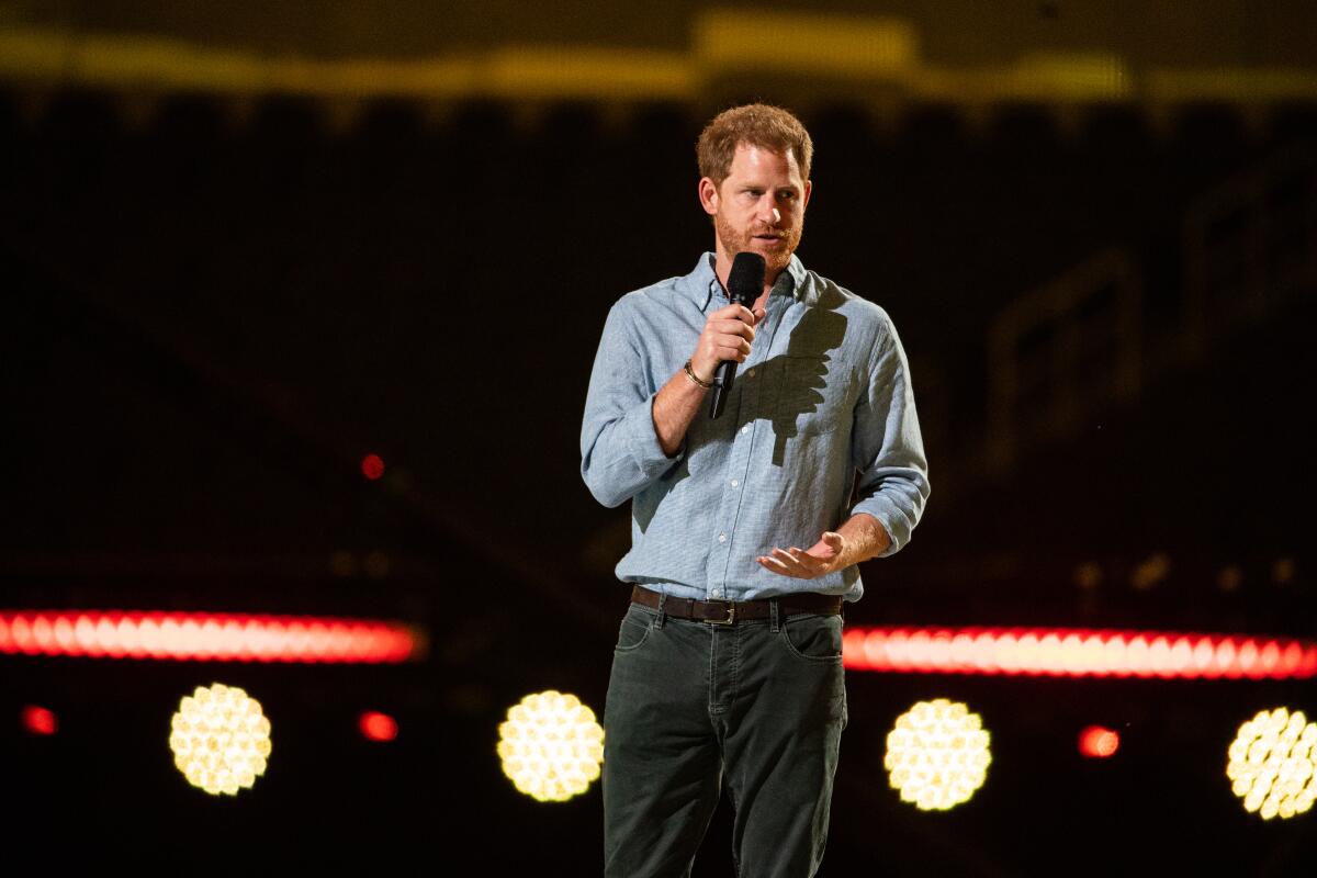 Prince Harry speaks during the concert at SoFi Stadium. 