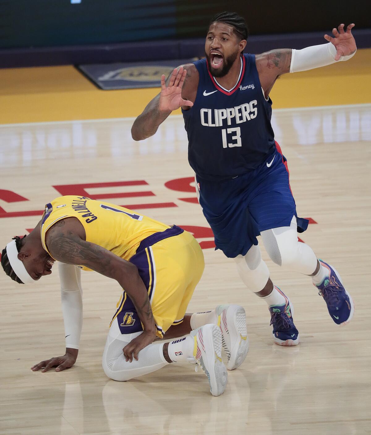 Clippers guard Paul George calls for the ball as Lakers guard Kentavious Caldwell-Pope holds his calf.