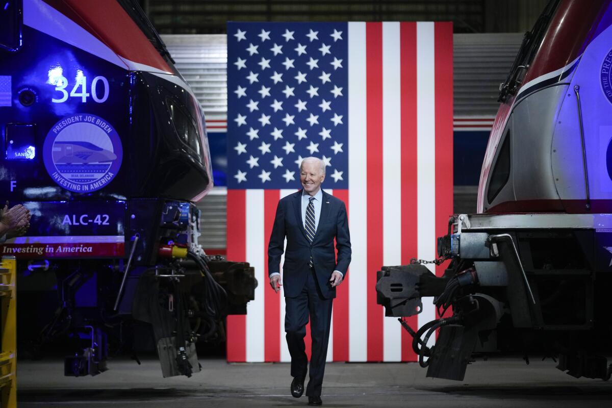 President Joe Biden arrives to speak at an Amtrak  maintenance facility