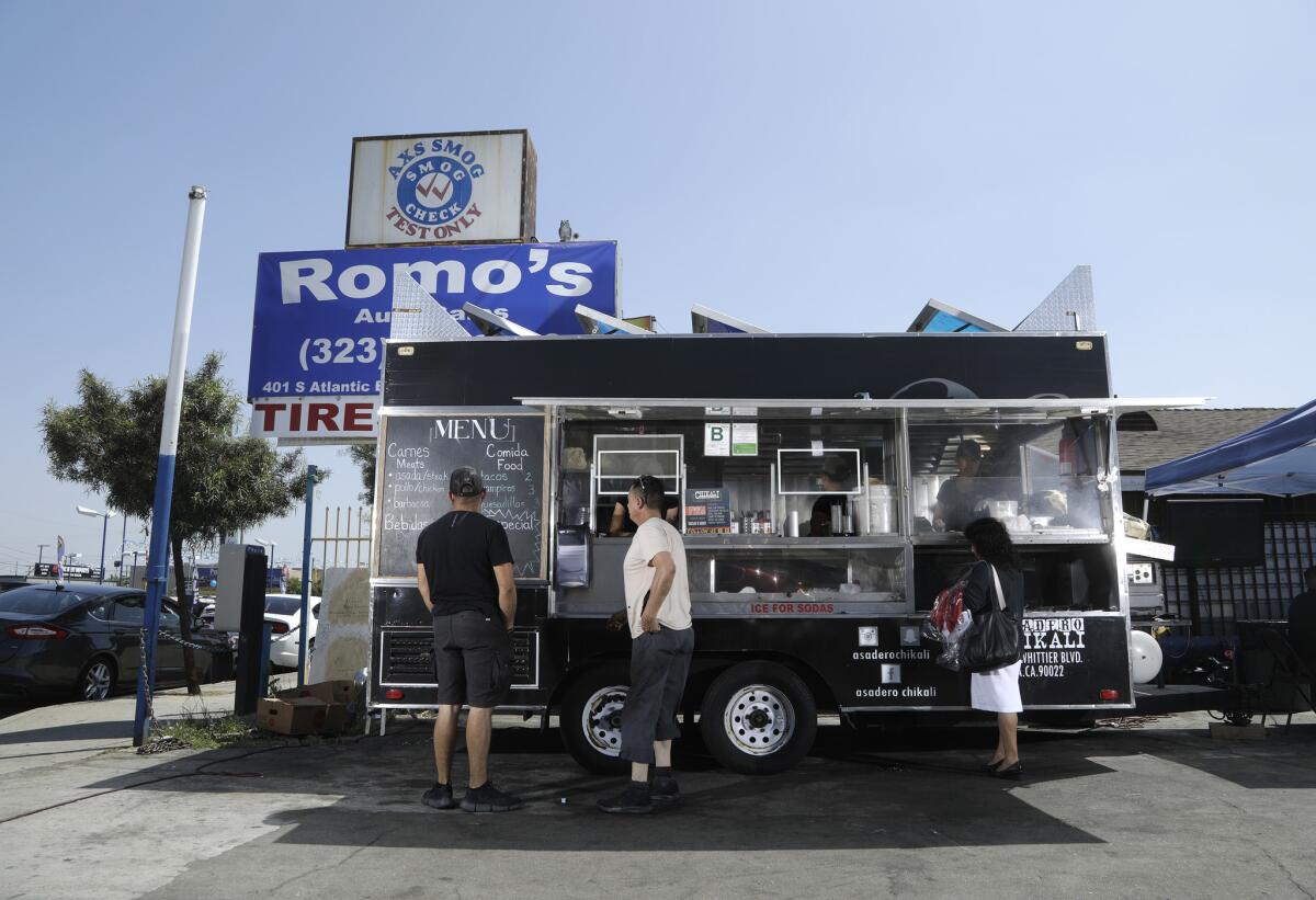 The family-owned taco truck, Asadero Chikali, serves breakfast, lunch and dinner from an auto dealership lot on S. Atlantic Boulevard in East Los Angeles.