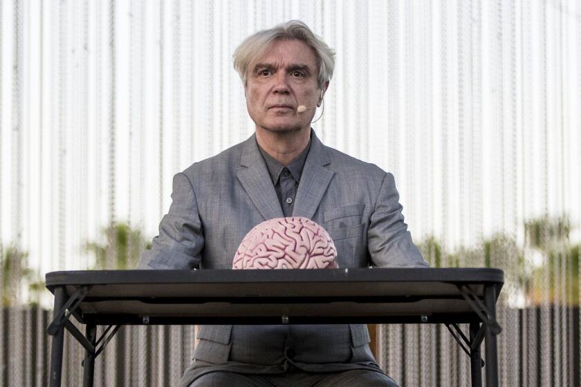 INDIO, CALIF. -- SATURDAY, APRIL 14, 2018: David Byrne on stage with a model brain at the Coachella Valley Music and Arts Festival in Indio, Calif., on April 14, 2018. (Brian van der Brug / Los Angeles Times)