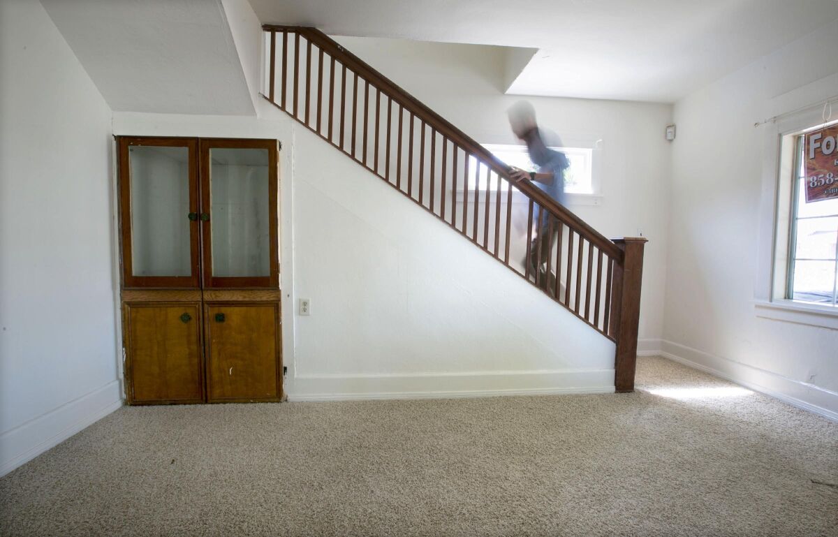 A listing for a three-bedroom house in the 2000 block of Harrison Avenue in Logan Heights includes a reference to a "Harry Potter room," because of the space underneath the main stairway in the two-story dwelling.