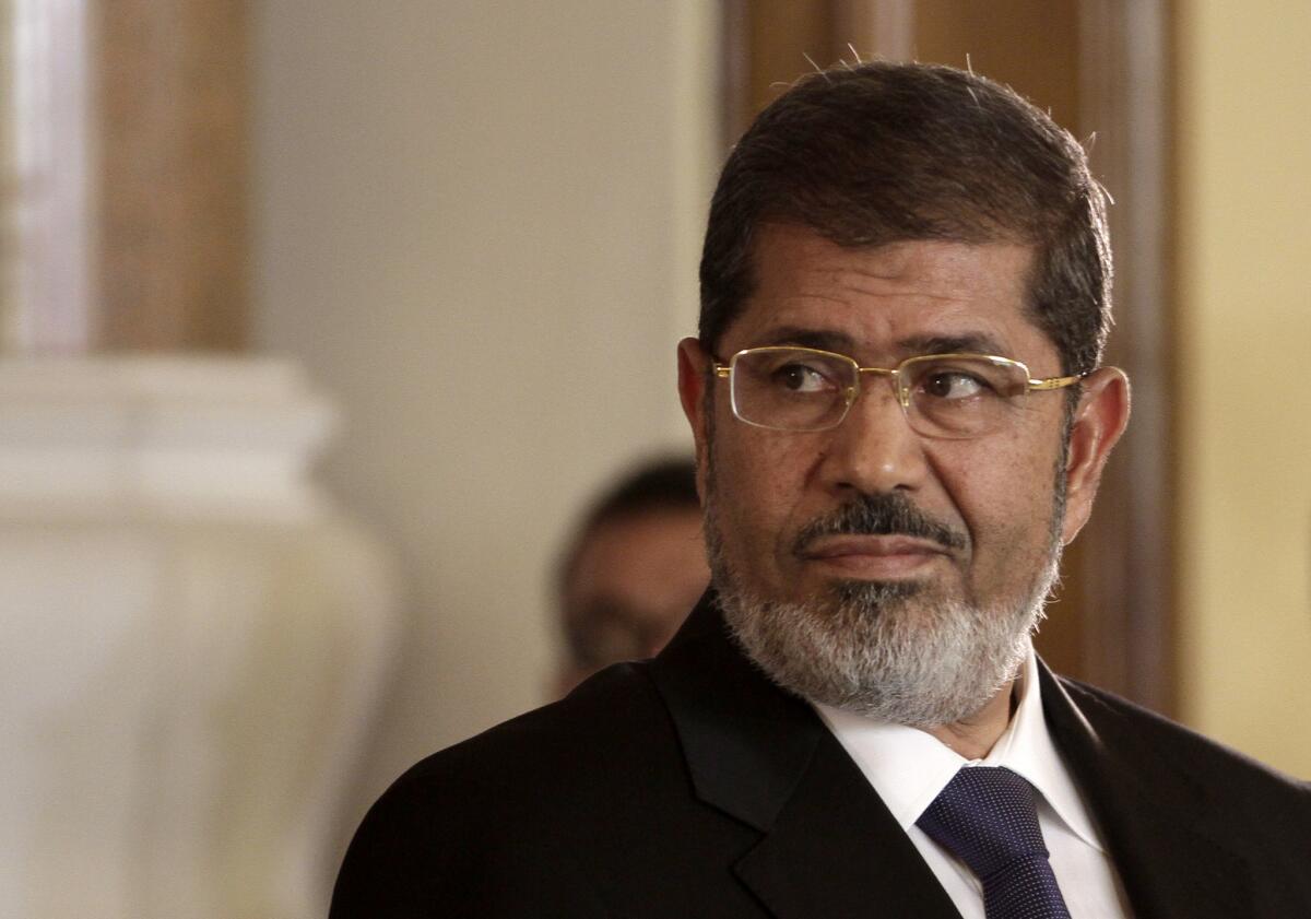Mohamed Morsi, seen in 2012, maintains he is still Egypt's legitimate leader, a Turkish news report said.