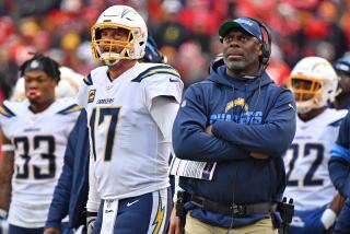 KANSAS CITY, MO - DECEMBER 29: Head coach Anthony Lynn (R) of the Los Angeles Chargers and quarterback Philip Rivers #17 look up at the replay during the second half against the Kansas City Chiefs at Arrowhead Stadium on December 29, 2019 in Kansas City, Missouri. (Photo by Peter Aiken/Getty Images)