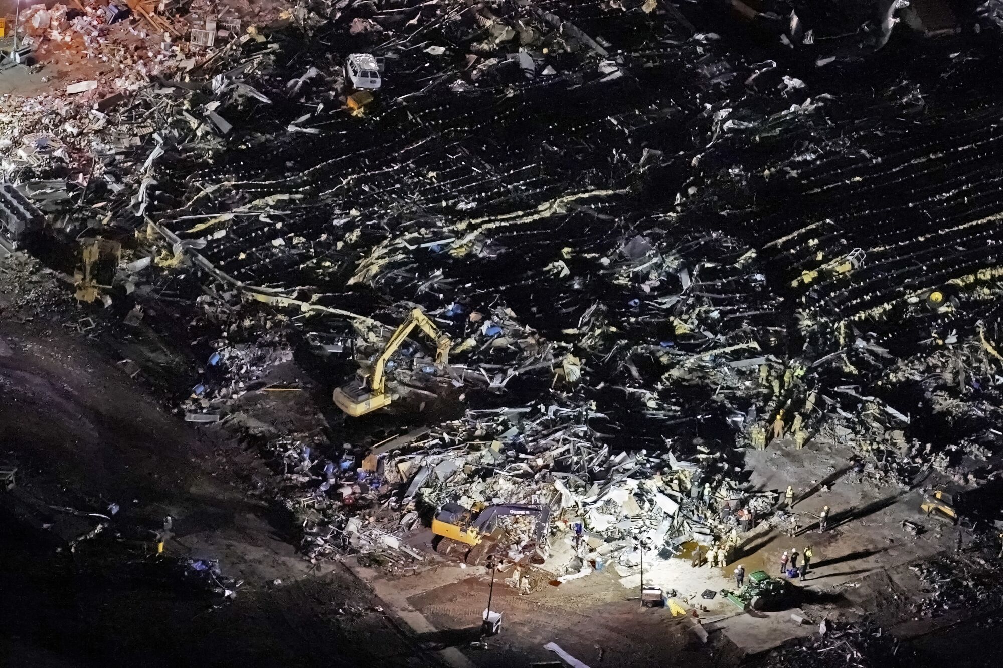 An aerial view of a collapsed factory.