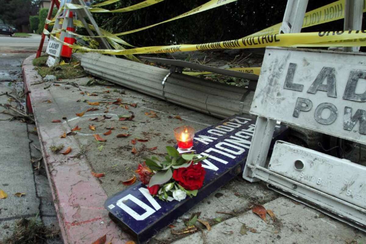 A make shift memorial at the accident scene, where two women died after being electrocuted and six others were injured Wednesday night after an SUV smashed into a fire hydrant and downed a light pole in Valley Village, sparking an electrical hazard.