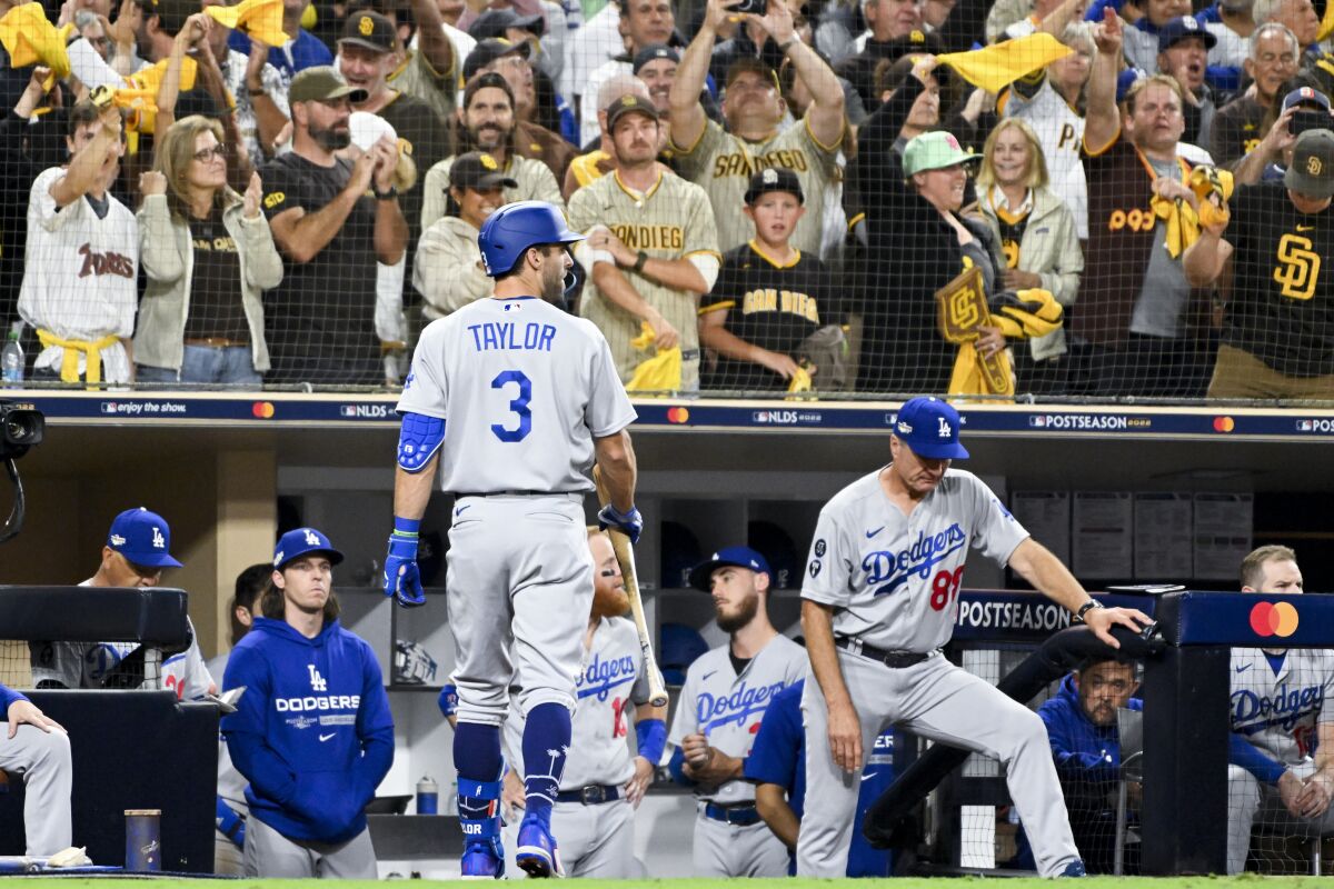 Dodgers' Chris Taylor walks back to the dugout after striking against the San Diego Padres on Oct. 14, 2022.