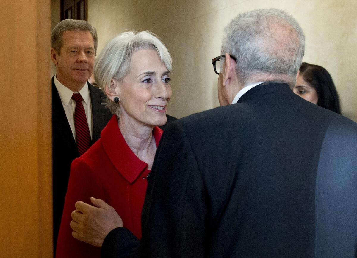 U.N. special envoy to Syria Lakhdar Brahimi, right, welcomes U.S. Undersecretary of State Wendy Sherman and Russian Deputy Foreign Minister Gennady Gatilov, left, at the United Nations office in Geneva on Monday, prior to a meeting on talks aimed at seeking a negotiated solution to the Syrian conflict.