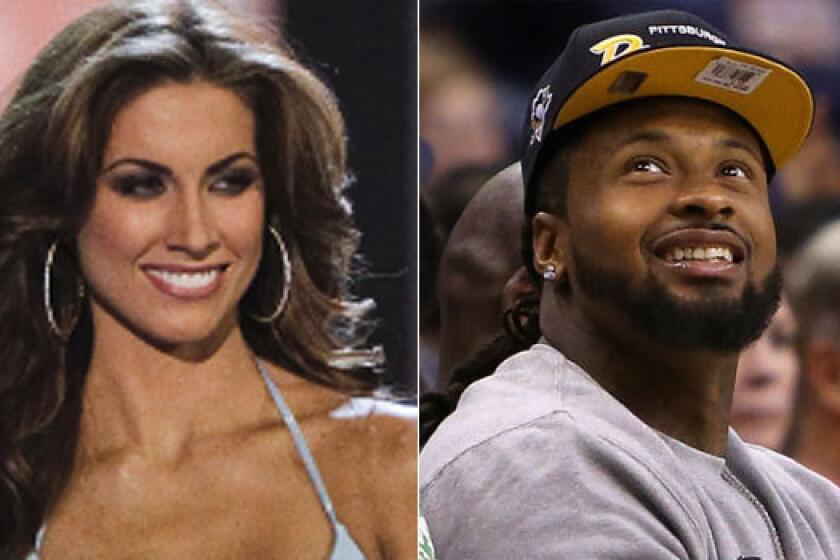 Arizona Cardinals defensive end Darnell Dockett, right, tweeted his phone number to Katherine Webb while her boyfriend, Alabama quarterback AJ McCarron, was playing in the BCS title game.