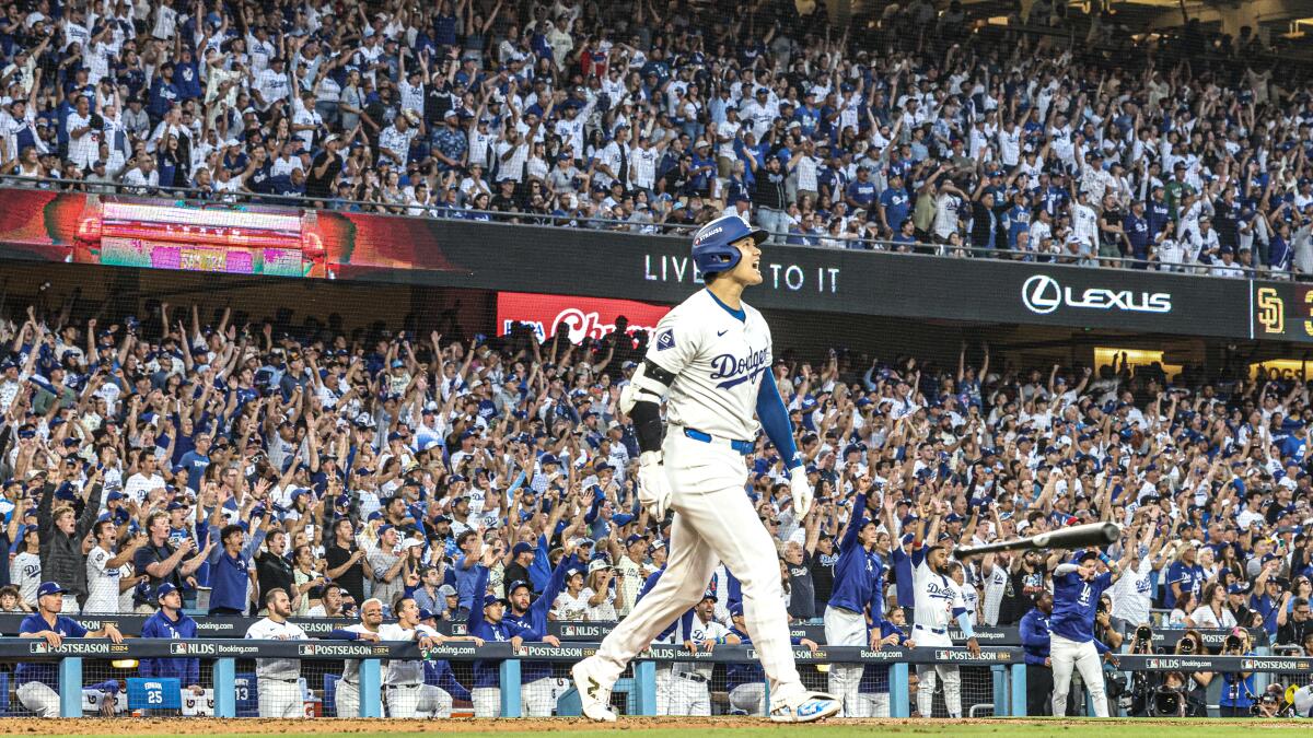 Dodgers star Shohei Ohtani reacts after hitting a three-run home run against the Padres.