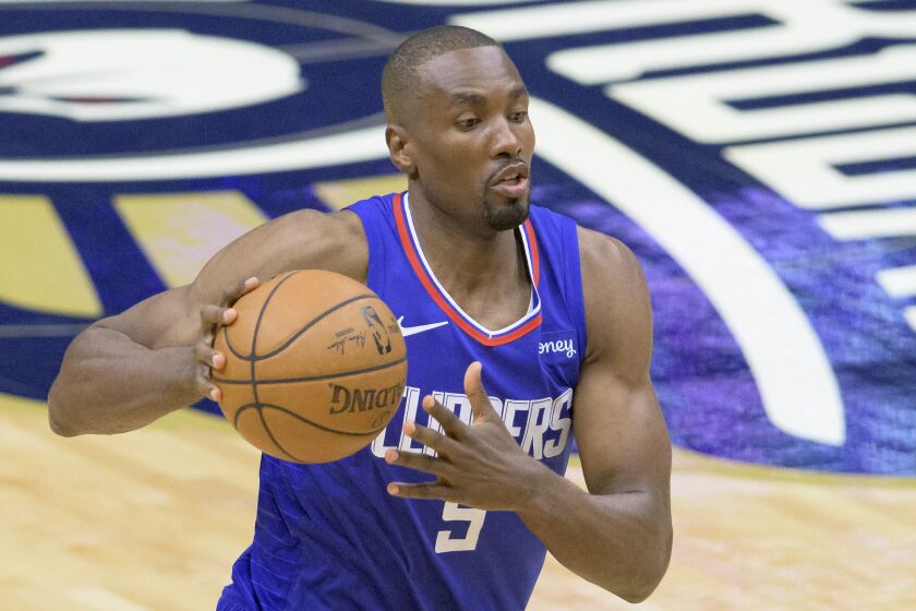 Los Angeles Clippers center Serge Ibaka (9) dribbles in the first half of an NBA basketball game.
