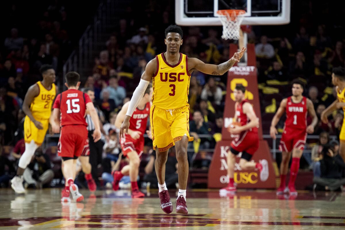 USC guard Elijah Weaver celebrates his three-point basket during the second half against Utah on Jan. 30 at the Galen Center.
