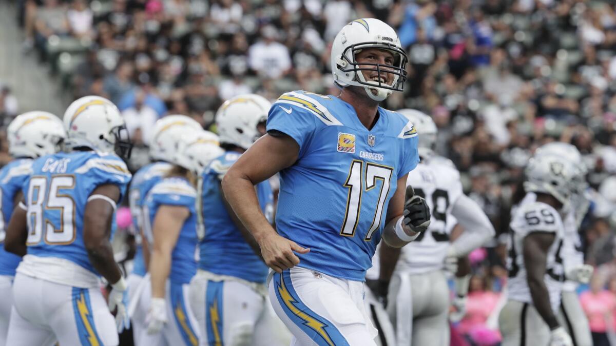 Chargers quarterback Philip Rivers smiles after leading the Chargers on a first half scoring drive against the Raiders at StubHub Center on Oct. 7.