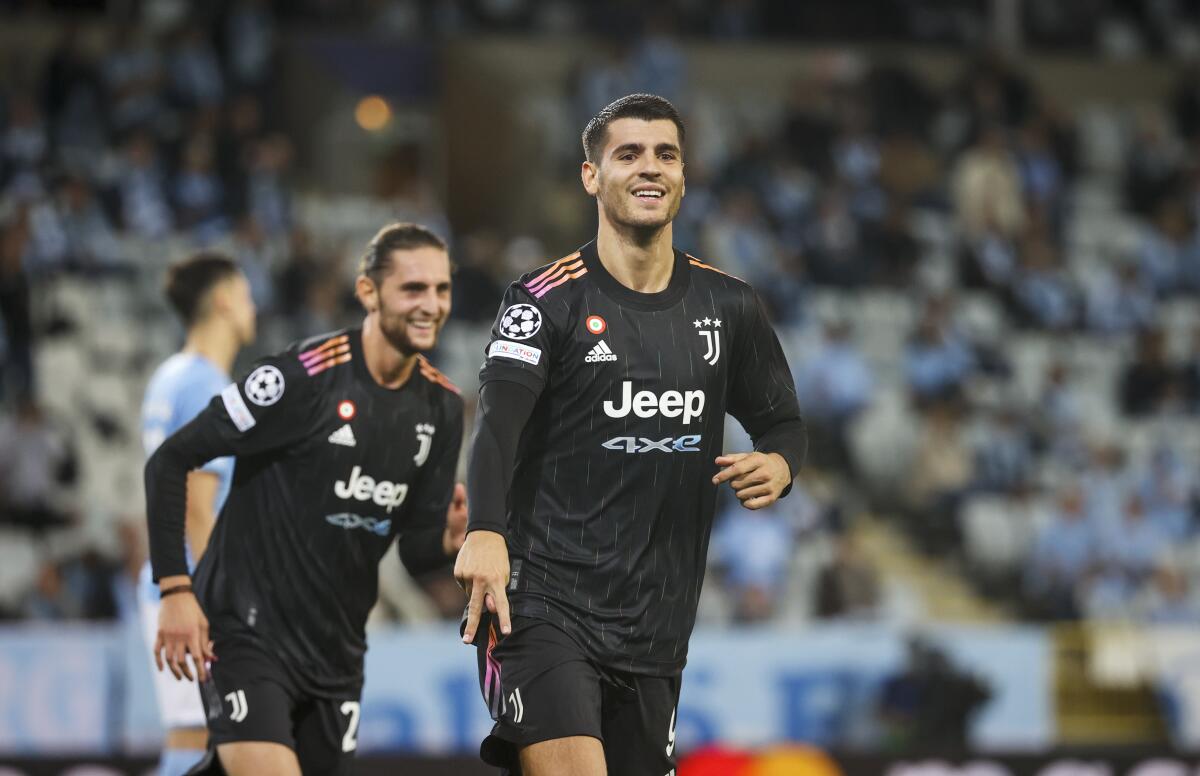 Juventus' Alvaro Morata celebrates scoring during the Champions League group H soccer match between Malmo FF and Juventus FC at Malmo New Stadium in Malmo, Sweden, Tuesday, Sept. 14, 2021. (Andreas Hillergren/TT News Agency via AP)