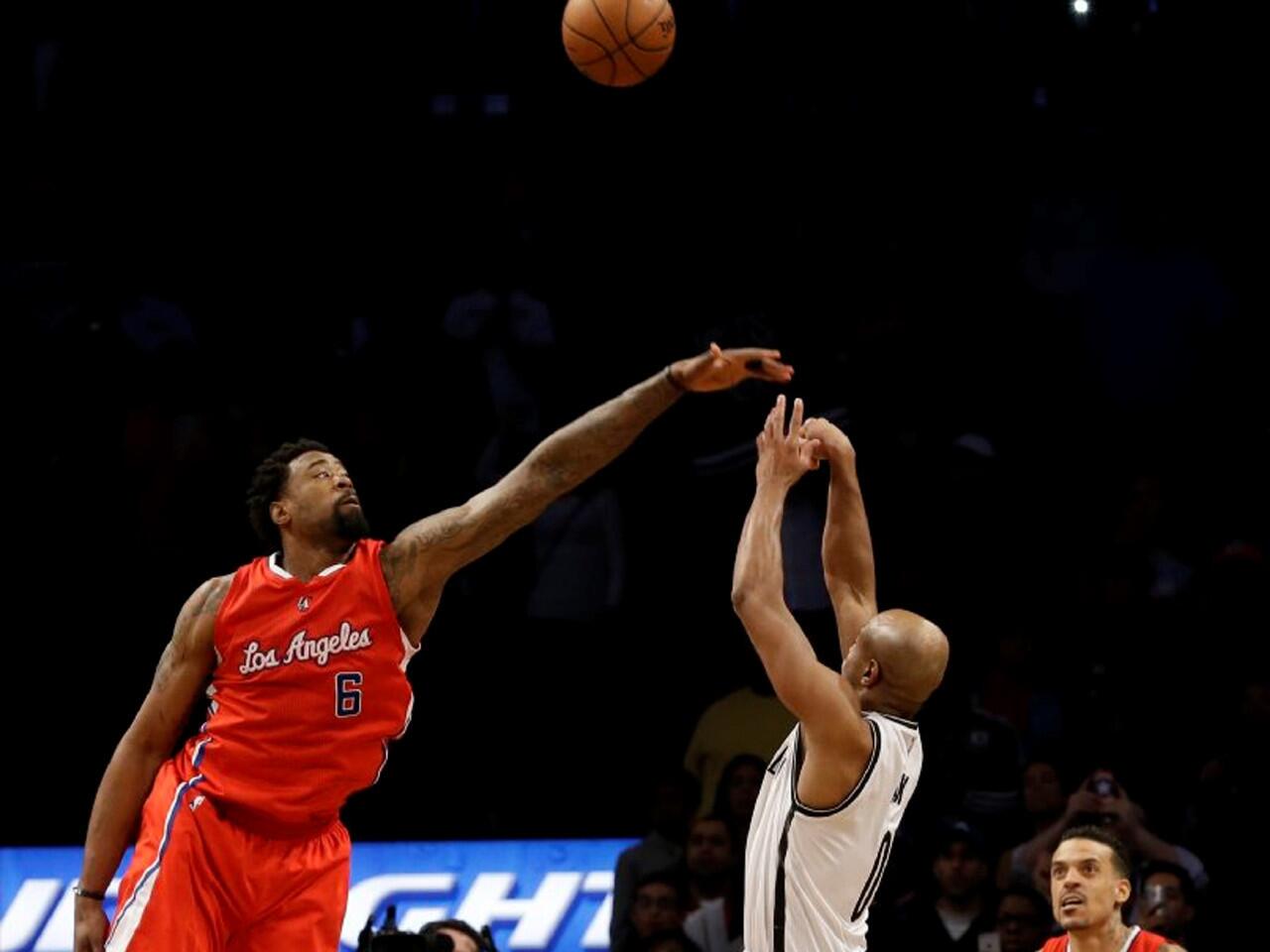 Nets guard Jarrett Jack hoists a rainbow shot over the outstretched hand of Clippers center DeAndre Jordan in the final seconds of the Nets' 102-100 victory.