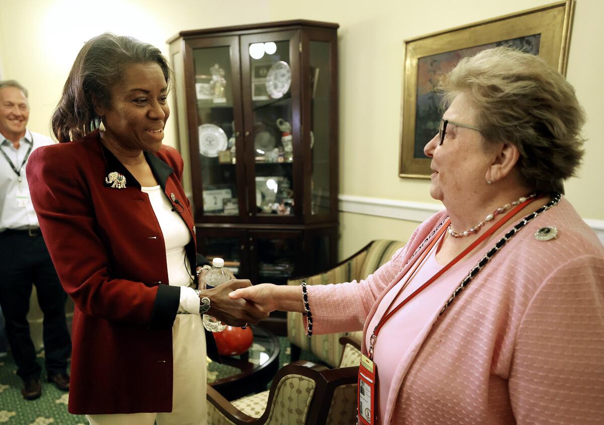 Winsome Sears shakes hands with Senate Clerk Susan Schaar