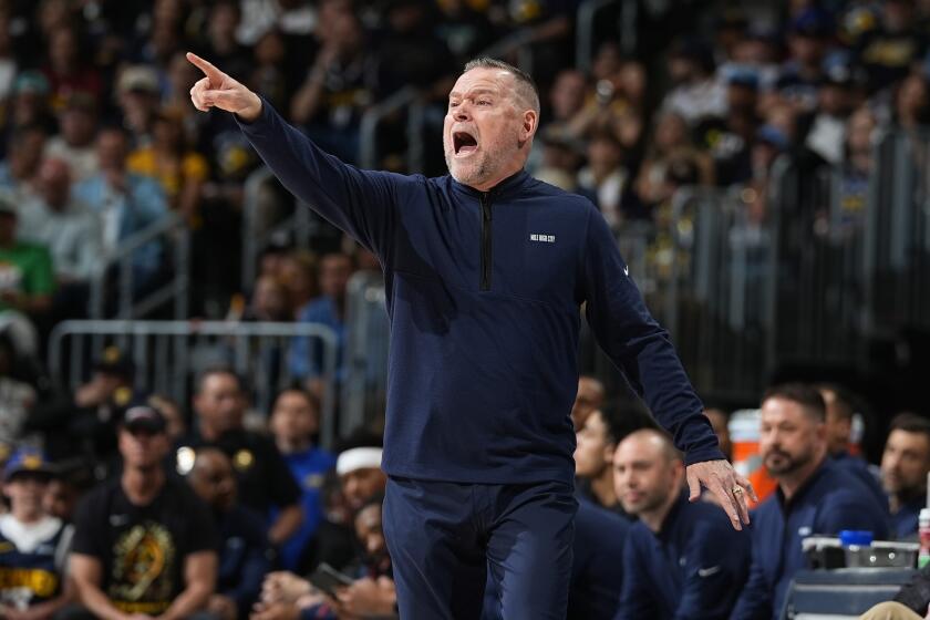 Denver Nuggets head coach Michael Malone directs his team in the first half of Game 1 of an NBA basketball second-round playoff series against the Minnesota Timberwolves Saturday, May 4, 2024, in Denver. (AP Photo/David Zalubowski)