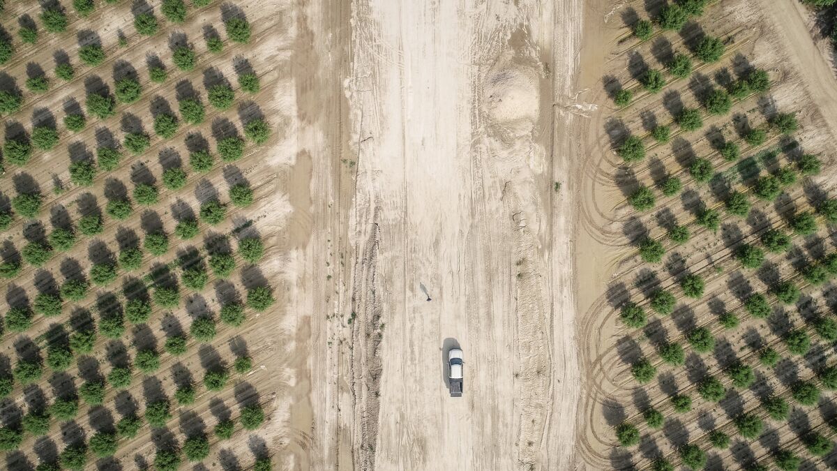 John Diepersloot's truck is parked on a swath of land cleared for the bullet train project.