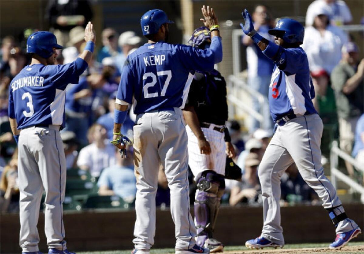 Dodgers' Juan Uribe, right, celebrates his three-run homer with teammates Matt Kemp and Skip Schumaker.