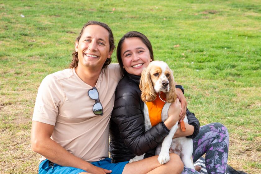 Tony Haidar with Angelica Green, who is holding dog Oscar.
