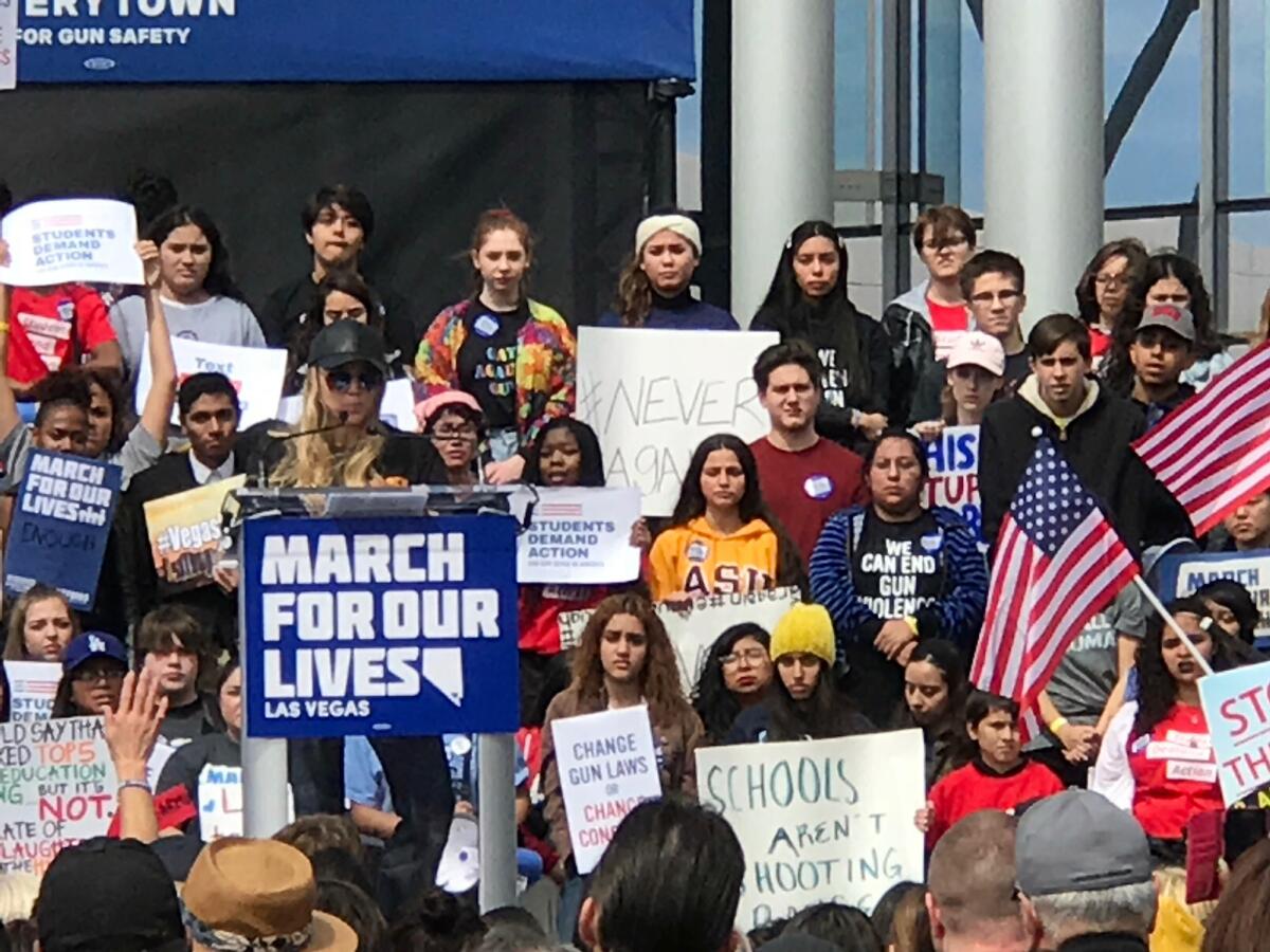 Stephanie Dobyns, left, speaks at Las Vegas' March for Our Lives rally.