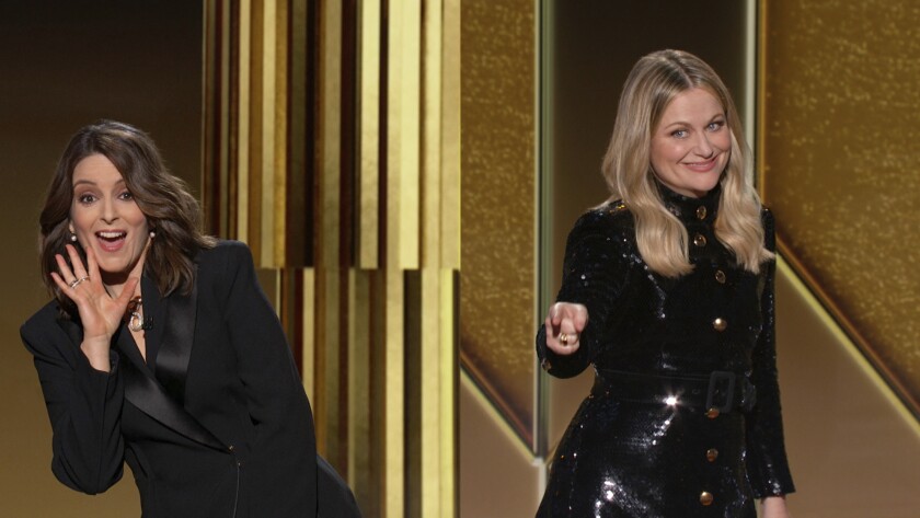 In this video grab issued Sunday, Feb. 28, 2021, by NBC, hosts Tina Fey, left, from New York, and Amy Poehler, from Beverly Hills, Calif., speak at the Golden Globe Awards. (NBC via AP)