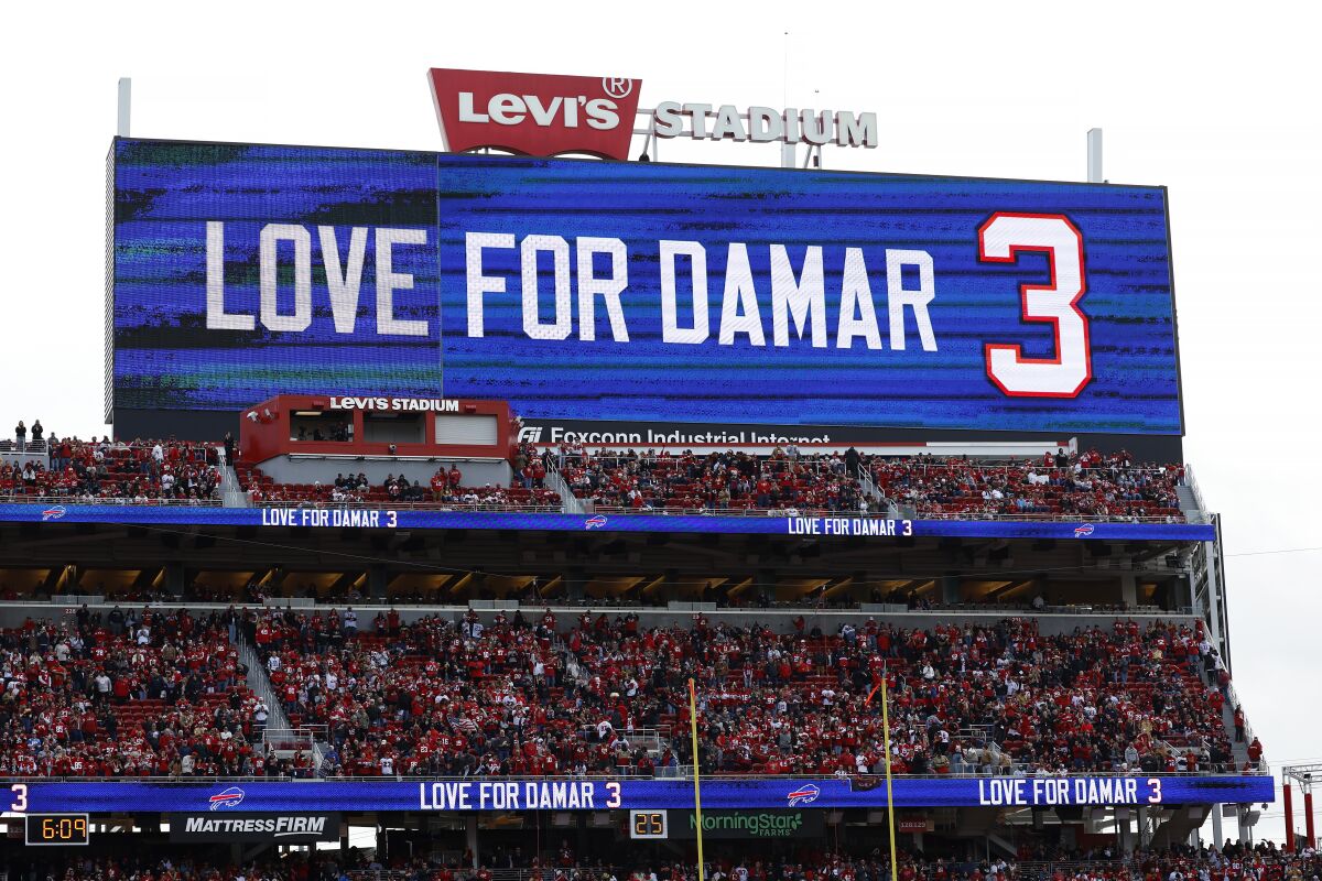 A video board at Levi's Stadium displays a message of support for Bill's safety Damar Hamlin.
