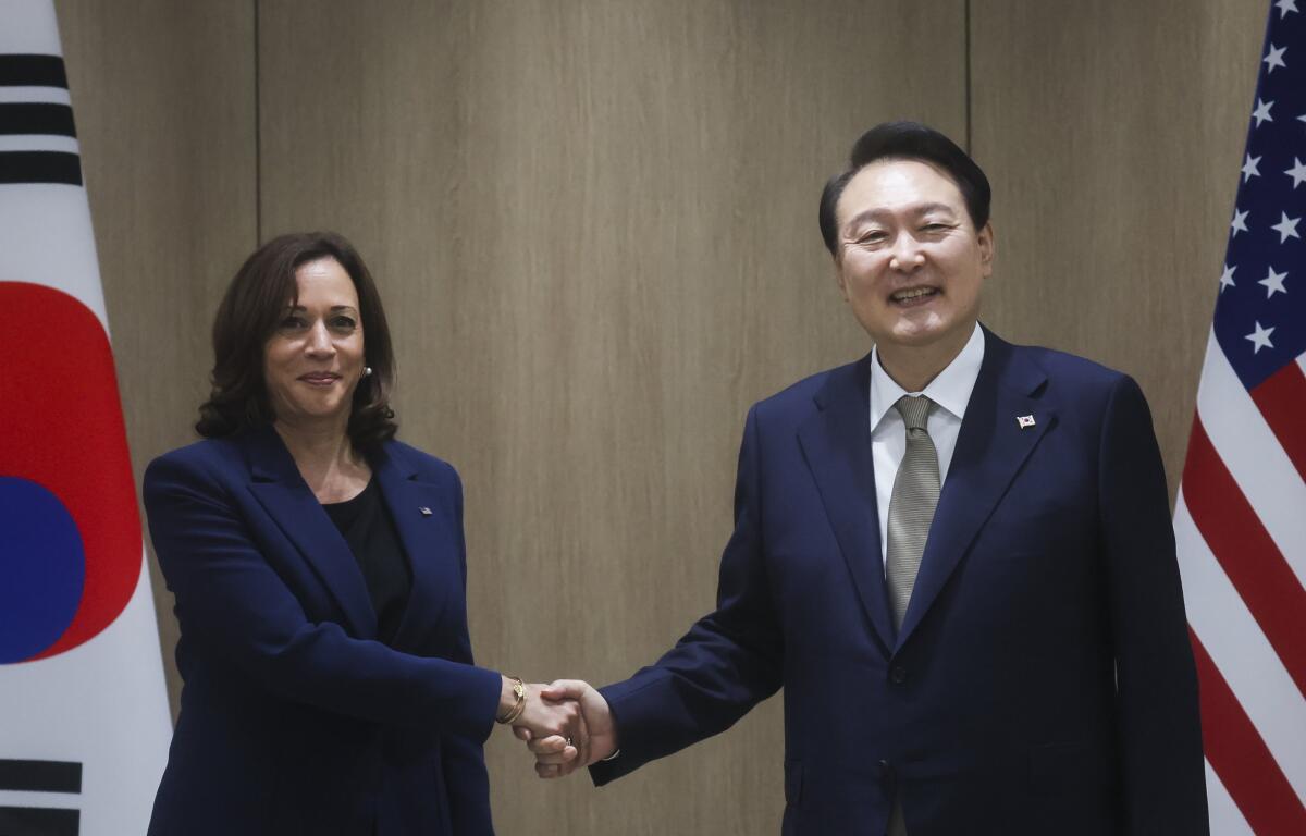 Vice President Kamala Harris shaking hands with South Korean President Yoon Suk-yeol