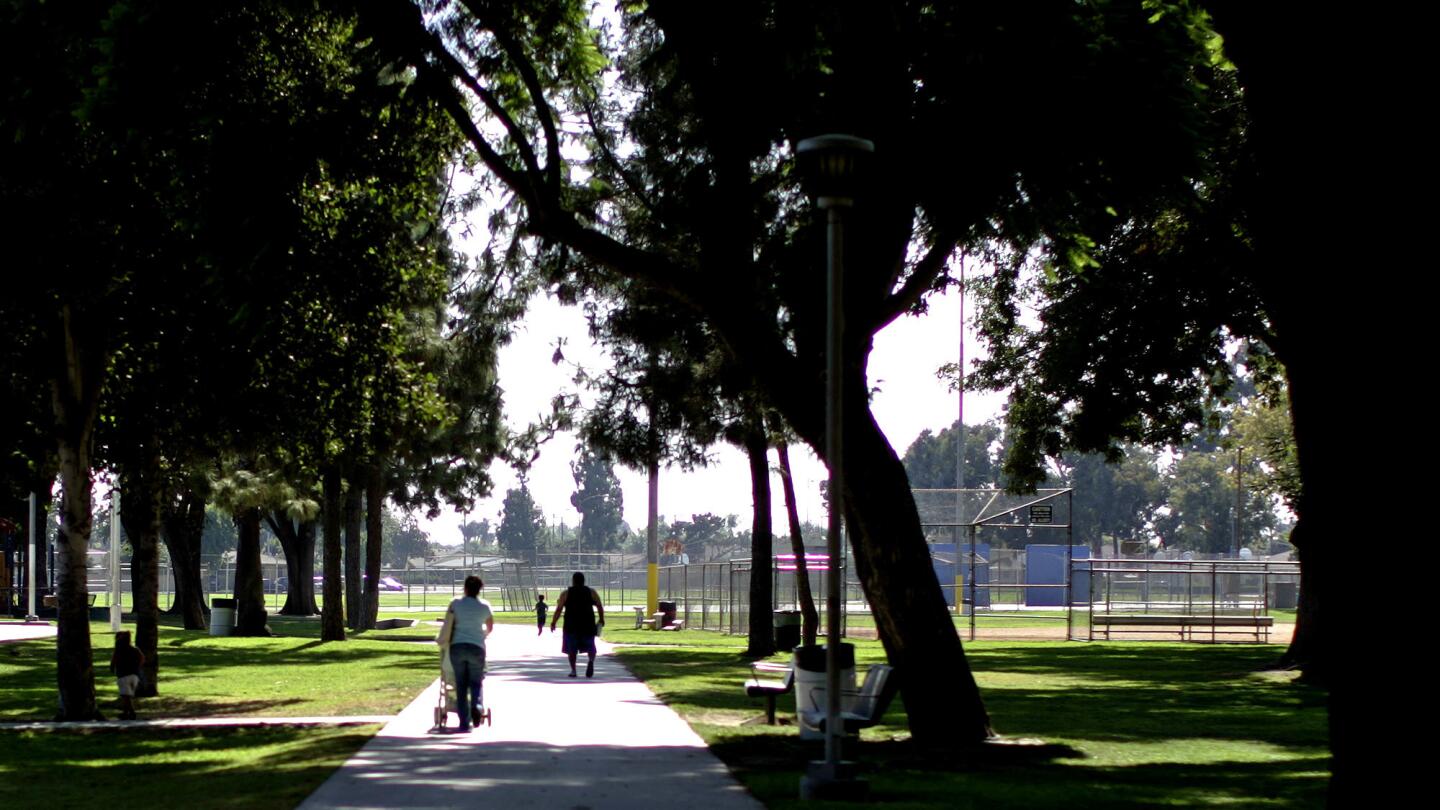 Residents enjoy a stroll through Smith Park in Pico Rivera.