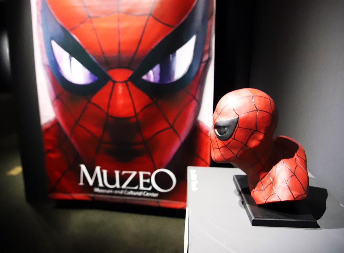 Alex Ross' "Spider-Man" bust and poster on display in "Marvelocity" at Muzeo in Anaheim.