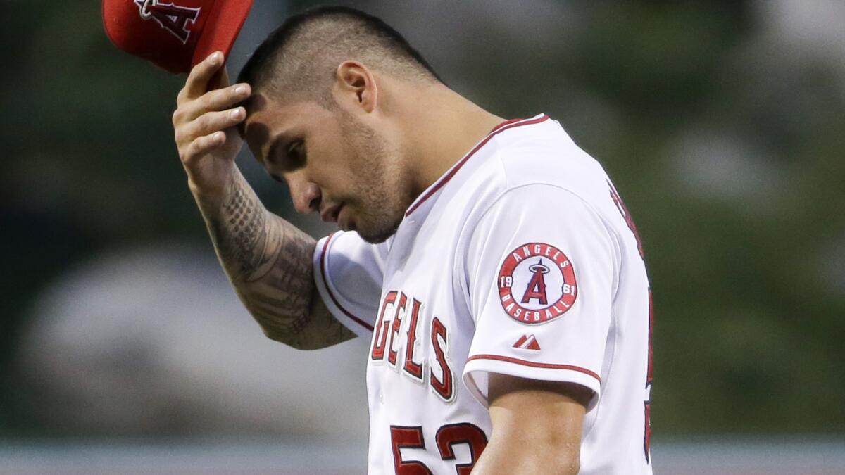 Angels starter Hector Santiago reacts after giving up five runs in the first inning of a game against the New York Yankees on May 7. Santiago was sent down to triple-A Salt Lake before Wednesday's win over the Houston Astros.