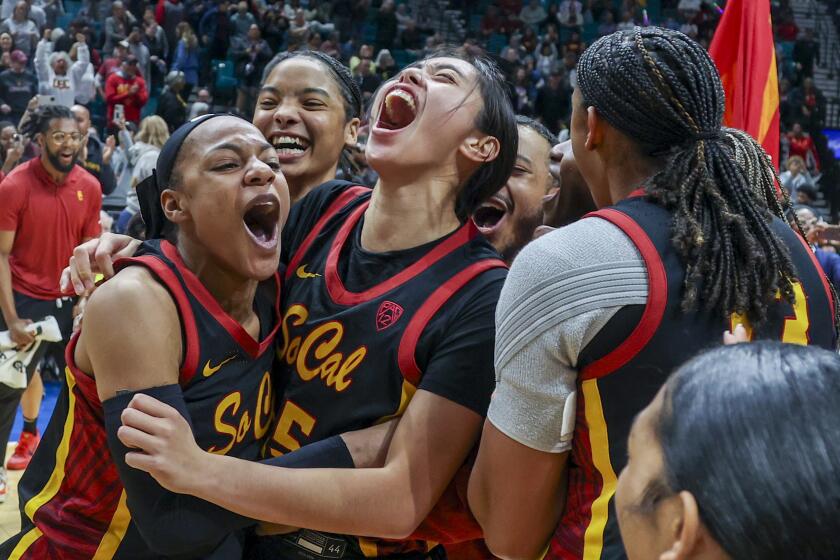 Southern California's Kayla Williams, left, and Kayla Padilla, second from left, celebrate.