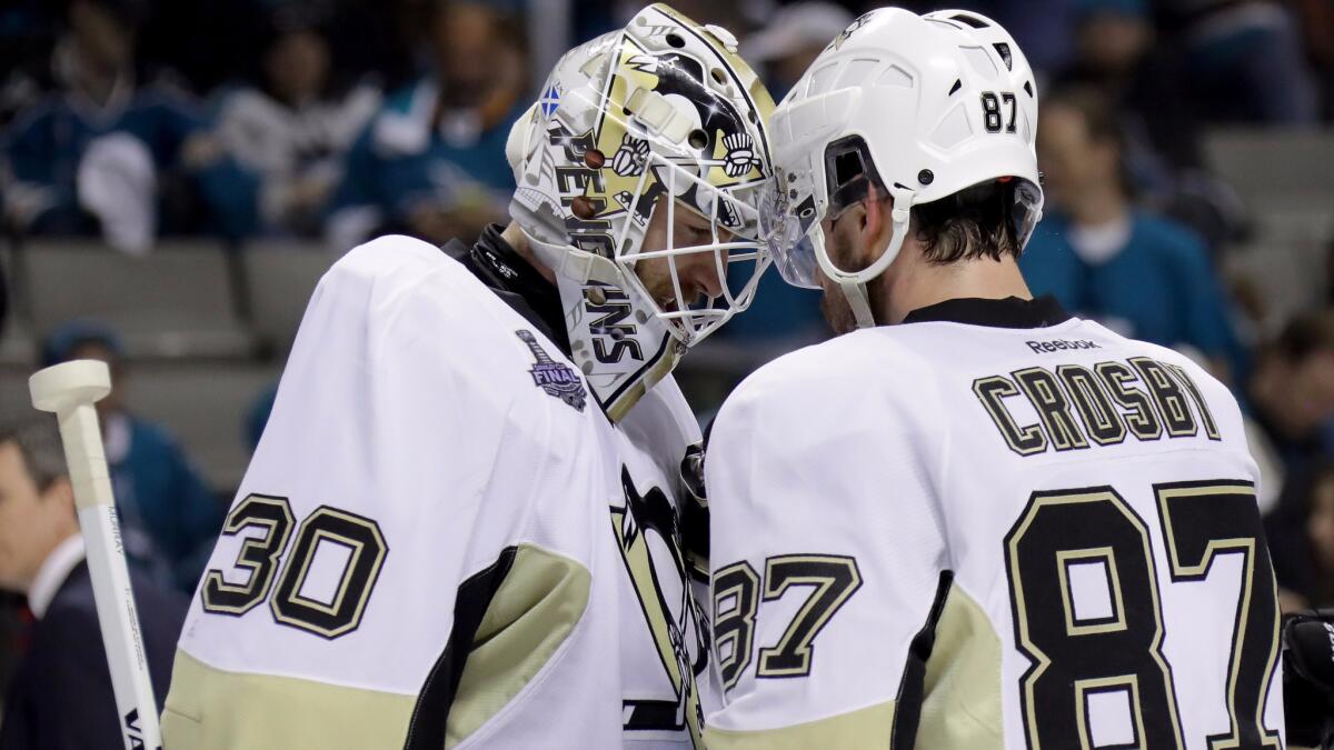 Center Sidney Crosby celebrates with goalie Matt Murray after the Penguins defeated the Sharks, 3-1, in Game 4 of the Stanley Cup Final.
